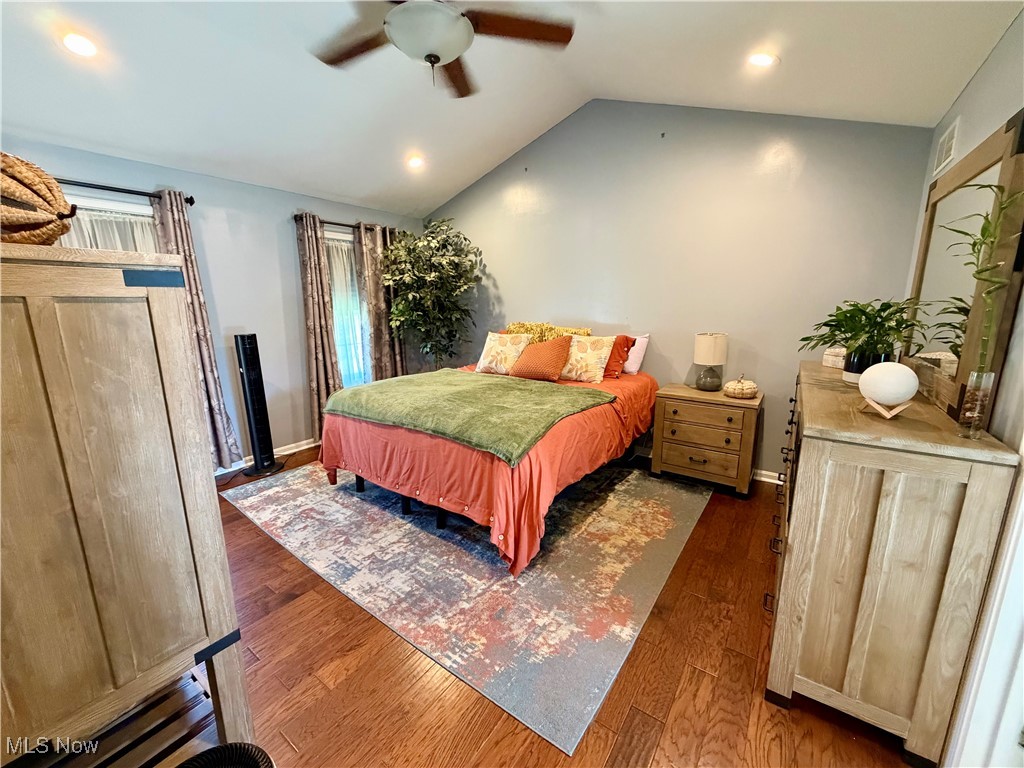 7374 Virginia Road Atwater, OH 44201 - Photo 21 of 49 Bedroom featuring lofted ceiling, dark wood-style floors, ceiling fan, and recessed lighting