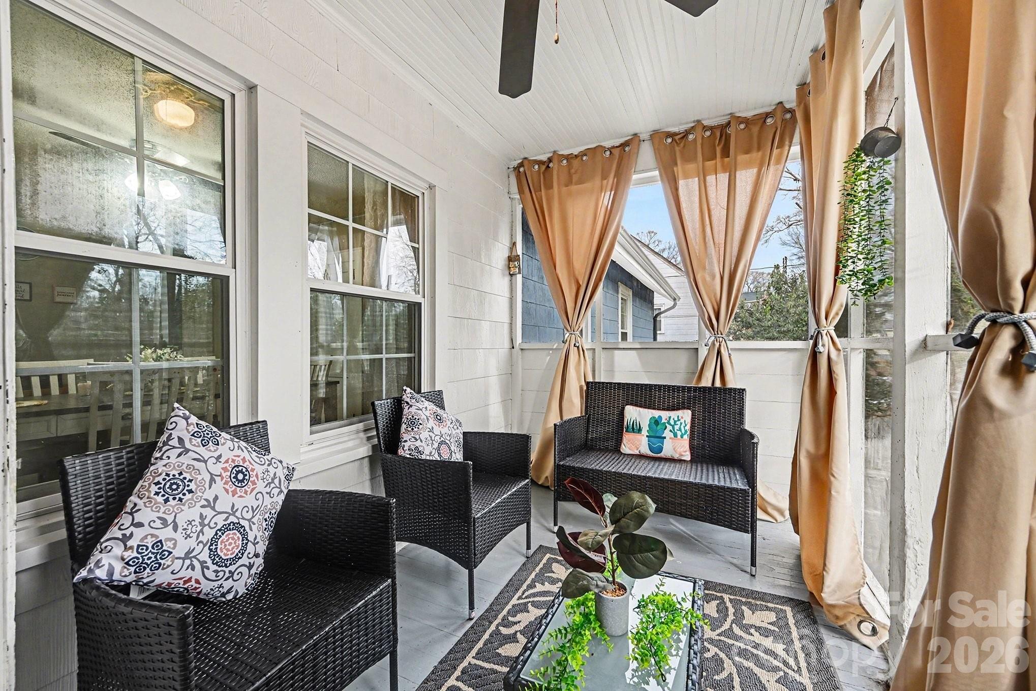 409 Miles Road Shelby, NC 28150 - Photo 11 of 23 a living room with furniture a fireplace and floor to ceiling windows