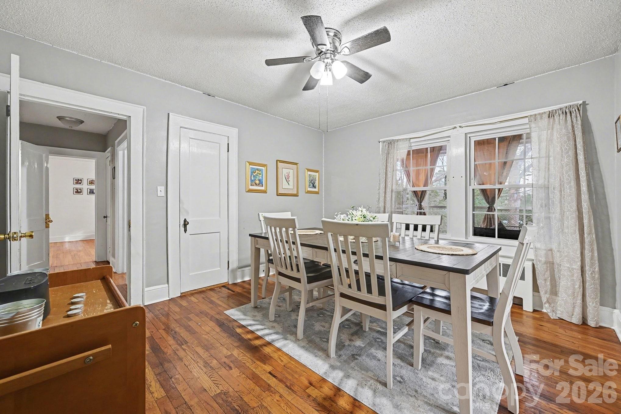 409 Miles Road Shelby, NC 28150 - Photo 2 of 23 a view of a dining room with furniture and wooden floor