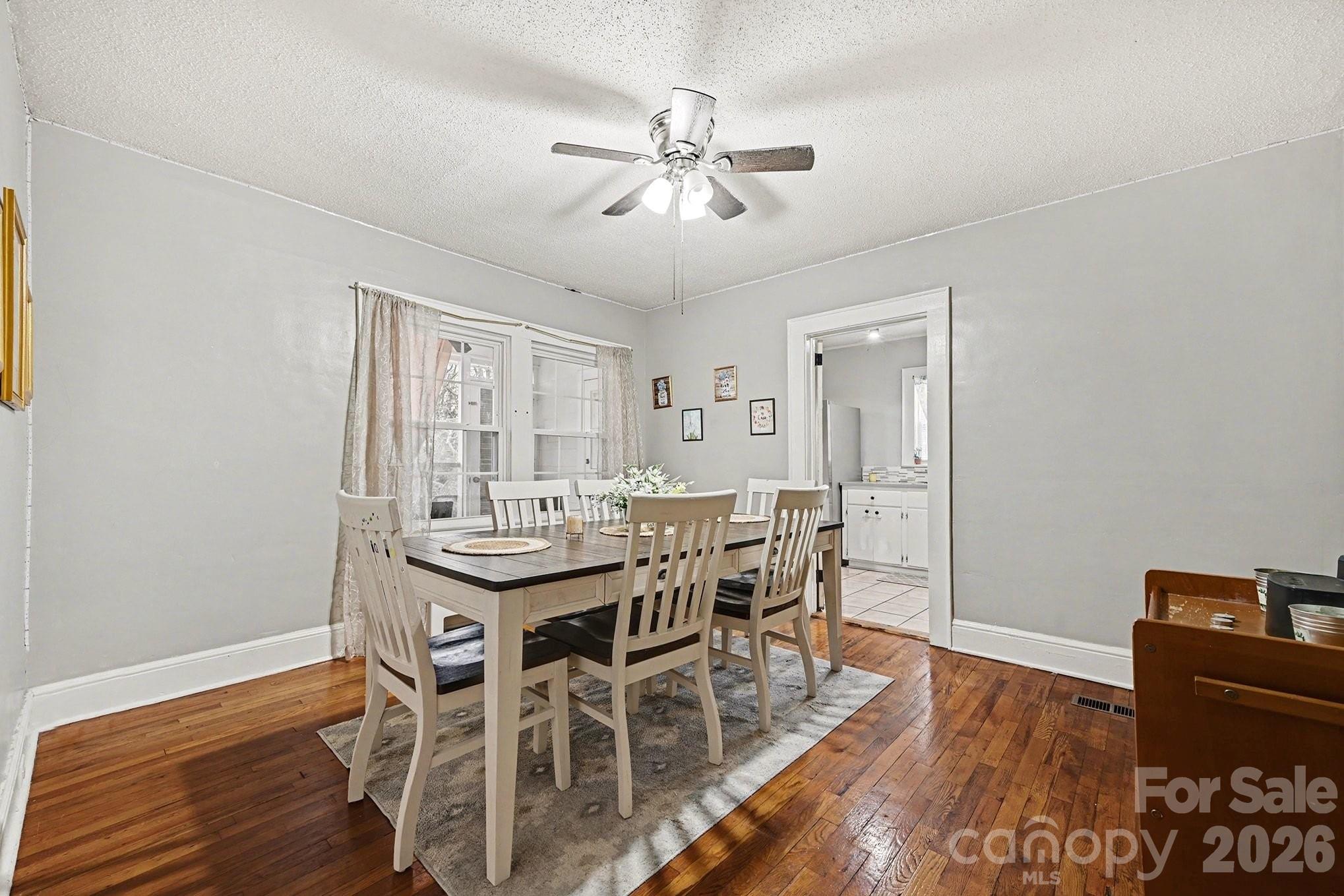 409 Miles Road Shelby, NC 28150 - Photo 3 of 23 a view of a dining room with furniture and wooden floor