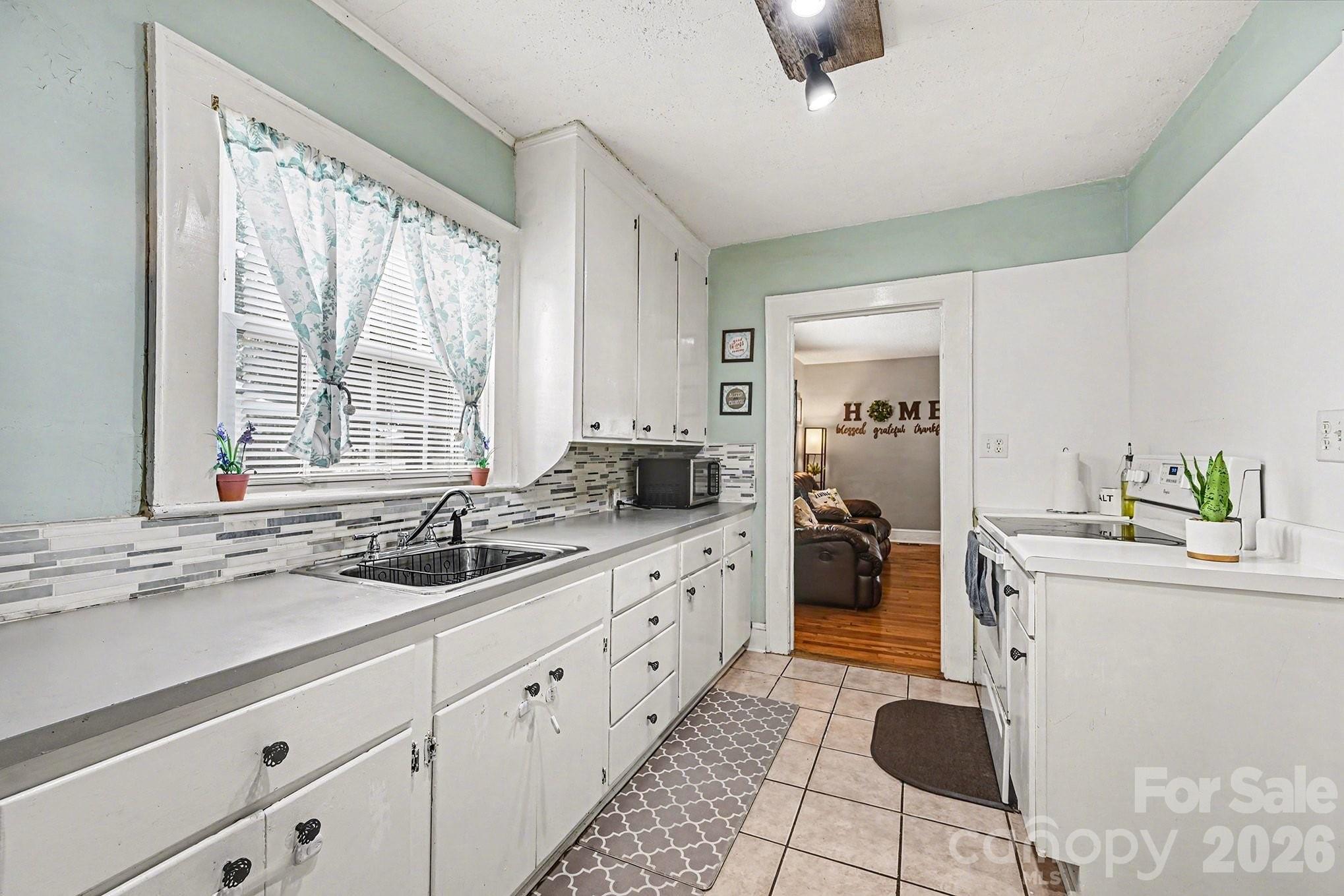 409 Miles Road Shelby, NC 28150 - Photo 5 of 23 a kitchen with sink cabinets and counter space
