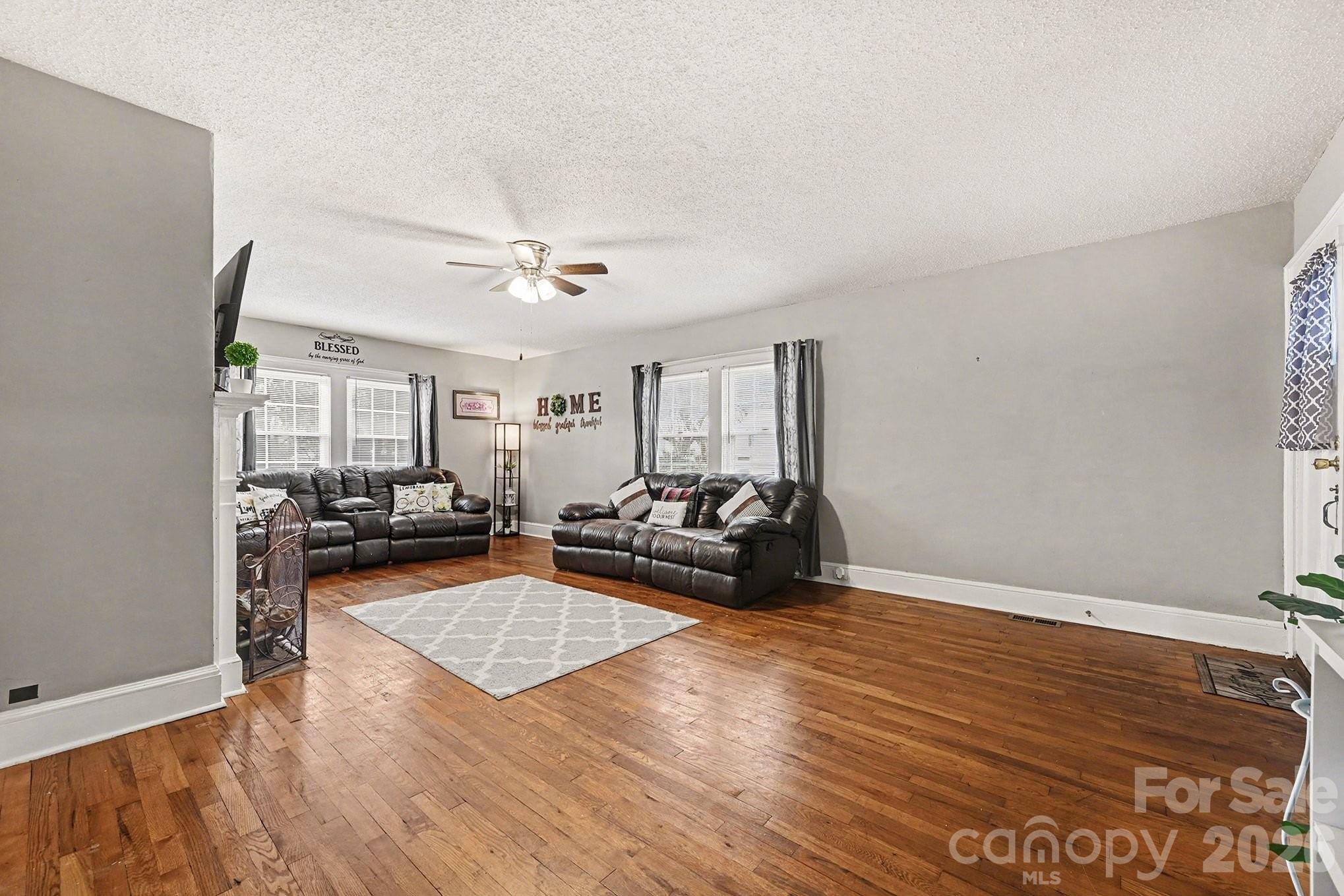 409 Miles Road Shelby, NC 28150 - Photo 8 of 23 a living room with furniture and a wooden floor