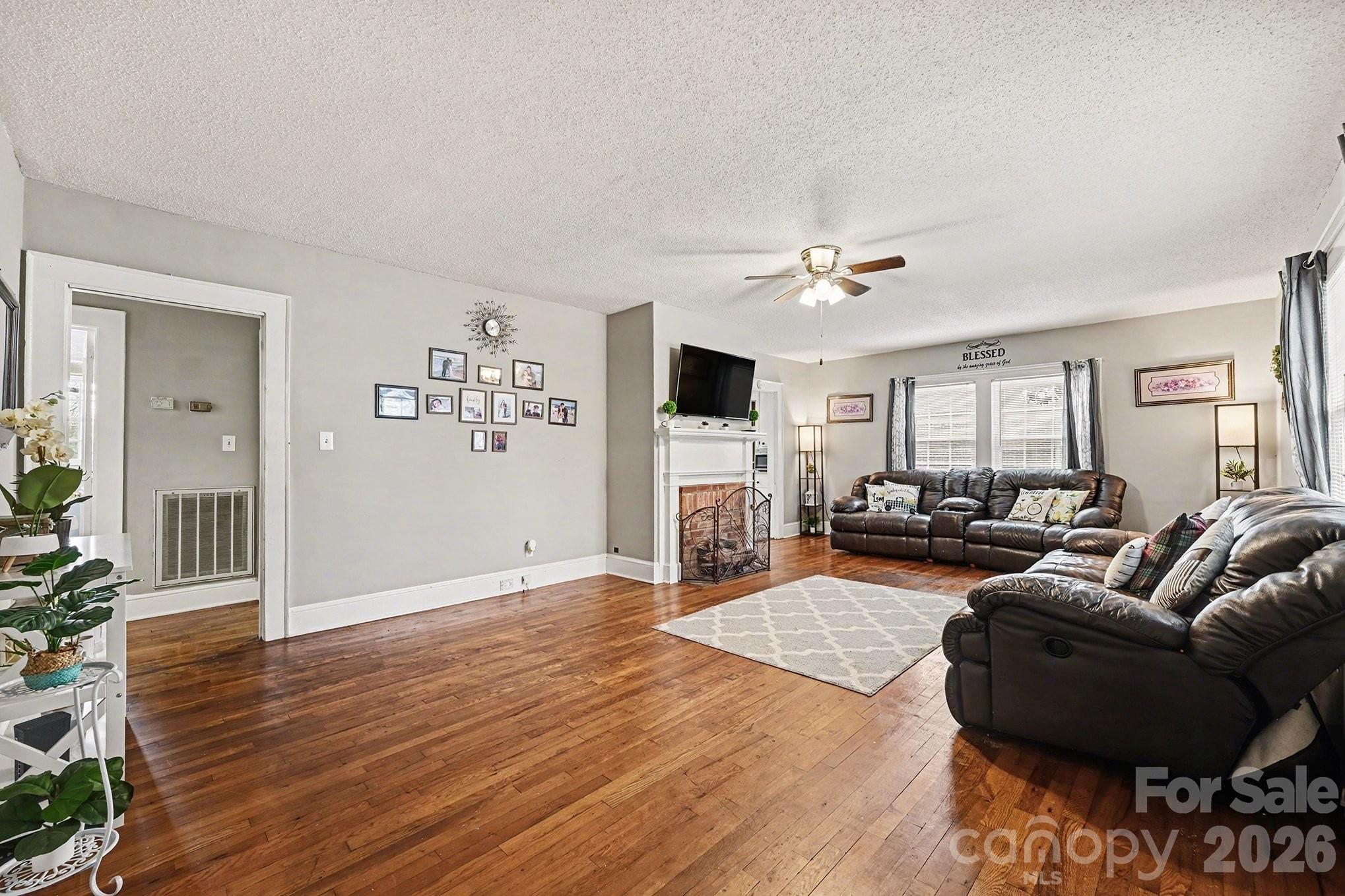 409 Miles Road Shelby, NC 28150 - Photo 9 of 23 a living room with furniture and a flat screen tv