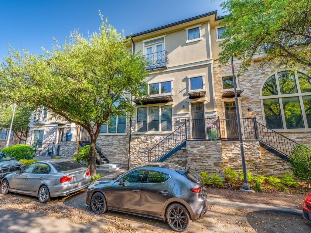 front view of a house with car parked