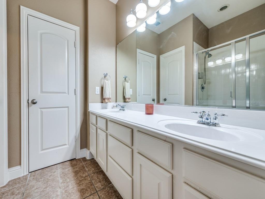 5721 Lunsford Road Plano, TX 75024 - Photo 12 of 17 a bathroom with a double vanity sink and a mirror