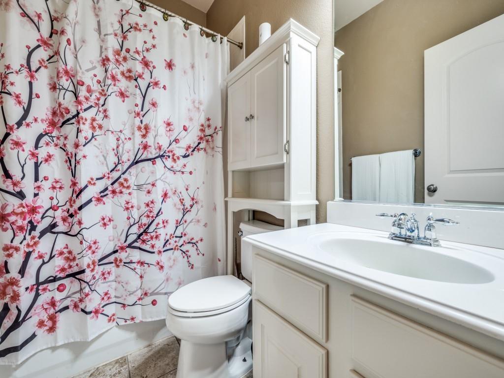5721 Lunsford Road Plano, TX 75024 - Photo 15 of 17 a bathroom with a sink toilet and shower
