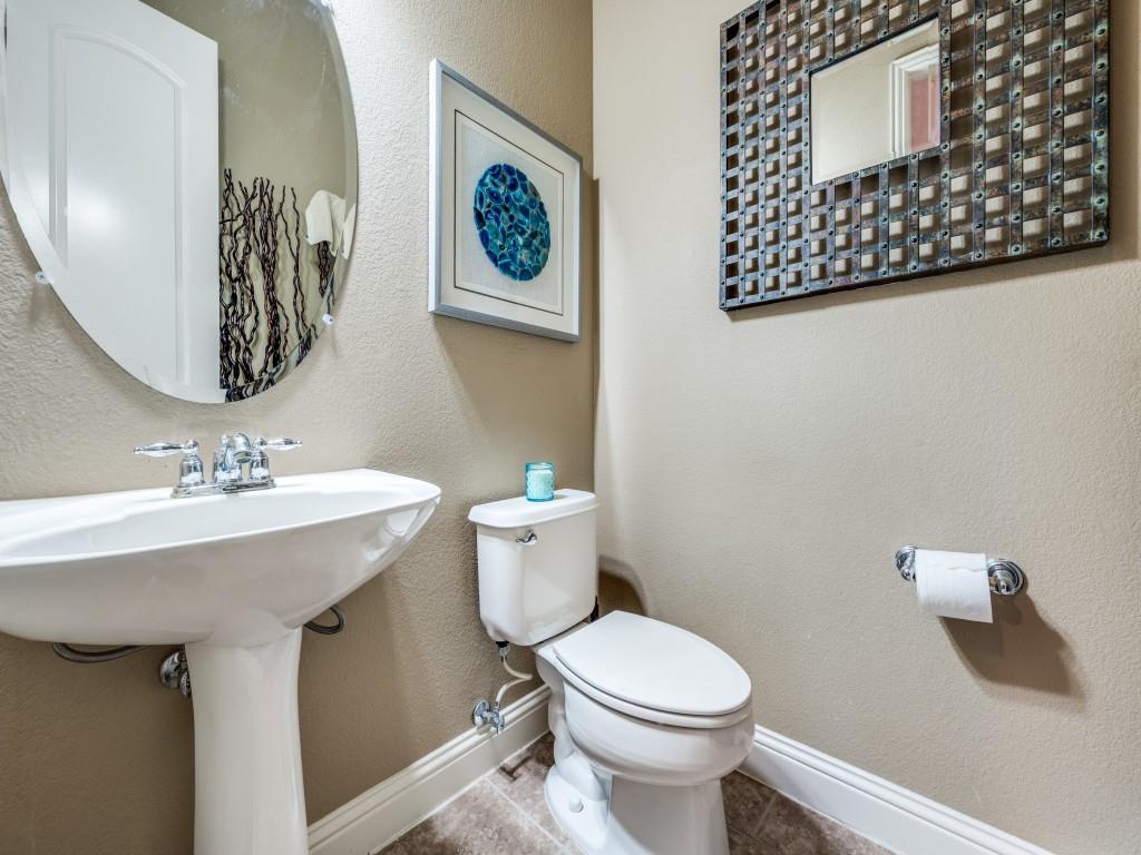 5721 Lunsford Road Plano, TX 75024 - Photo 17 of 17 a bathroom with a toilet sink and mirror