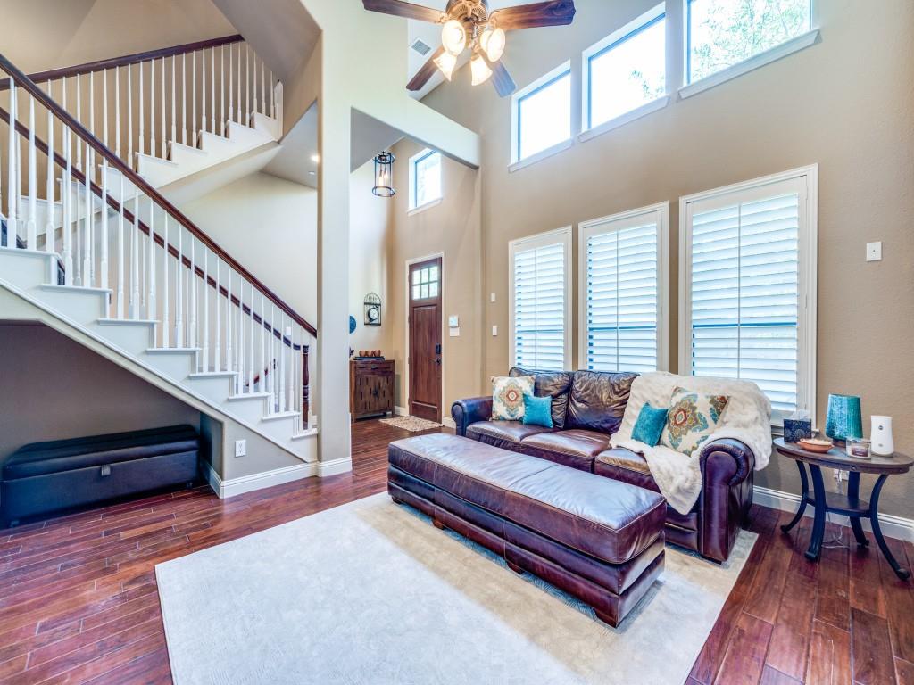 5721 Lunsford Road Plano, TX 75024 - Photo 3 of 17 a living room with furniture and a dining table