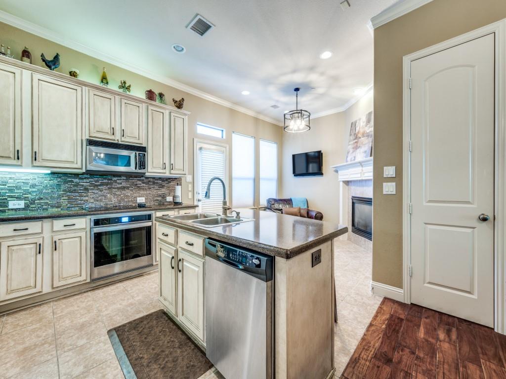 5721 Lunsford Road Plano, TX 75024 - Photo 5 of 17 a kitchen with stainless steel appliances granite countertop a sink stove and refrigerator