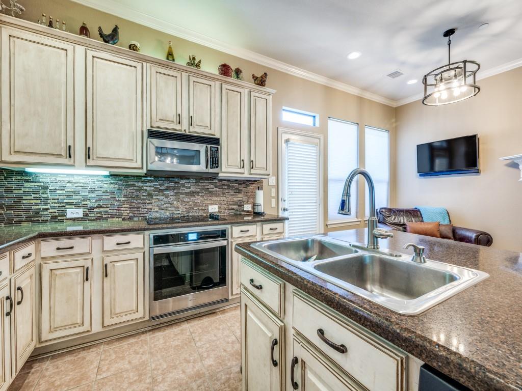 5721 Lunsford Road Plano, TX 75024 - Photo 6 of 17 a kitchen that has a sink and a stove