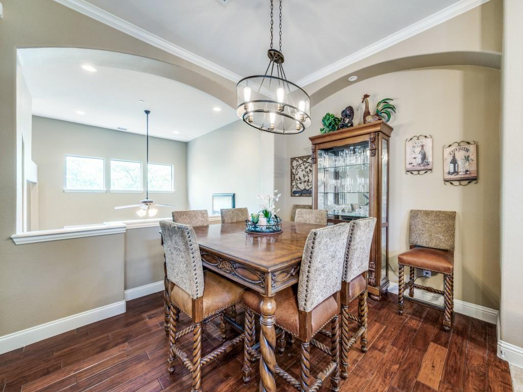 5721 Lunsford Road Plano, TX 75024 - Photo 9 of 17 a view of a dining room with furniture wooden floor and chandelier