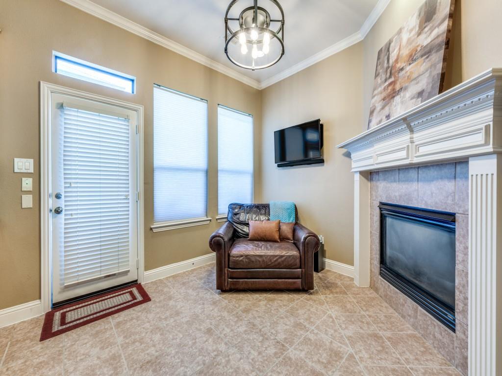 5721 Lunsford Road Plano, TX 75024 - Photo 10 of 17 a living room with furniture a flat screen tv and a fireplace