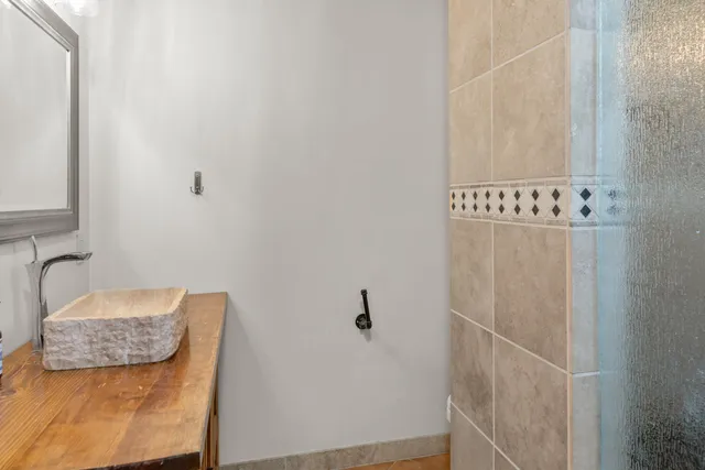 a bathroom with a bathtub and shower