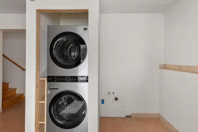 a bed room with a bed and a window