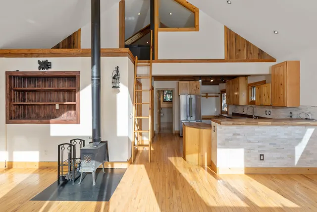 a view of a living room and kitchen