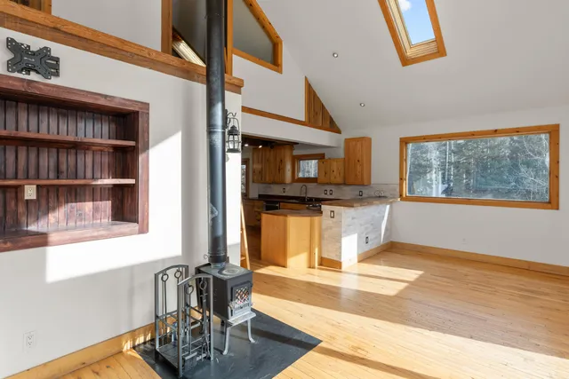 a view of a living room with furniture and a window