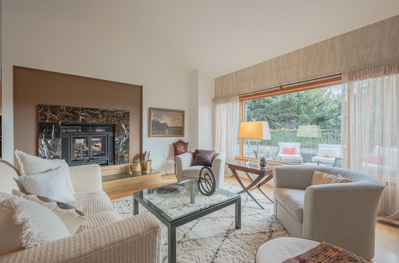 3472 Lazarro Drive Carmel, CA 93923 - Photo 12 of 35 a living room with fireplace furniture and a large window