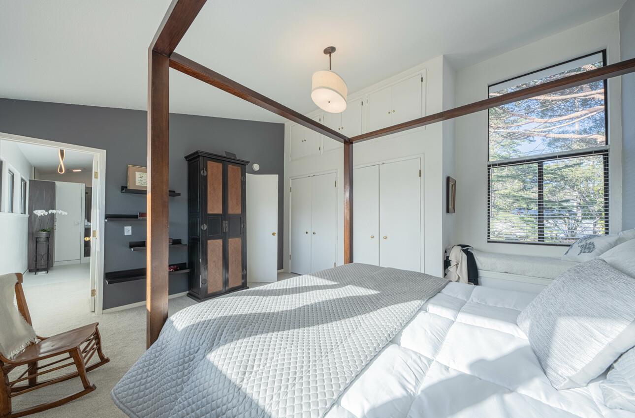 3472 Lazarro Drive Carmel, CA 93923 - Photo 19 of 35 a bedroom with a bed and a large window