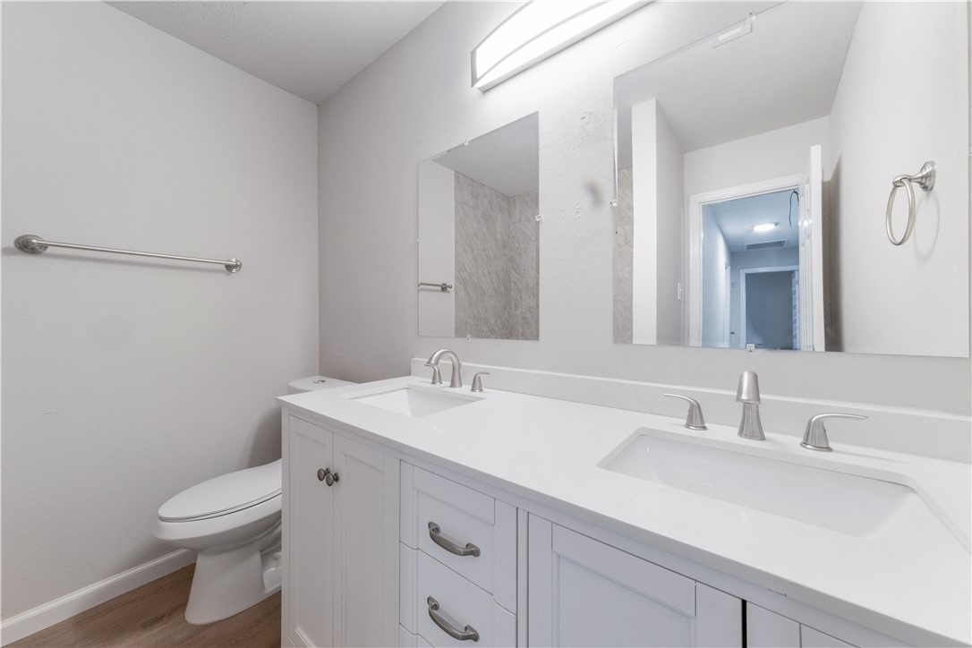 3901 Skipton Drive Austin, TX 78727 - Photo 15 of 21 a bathroom with a sink toilet vanity and mirror