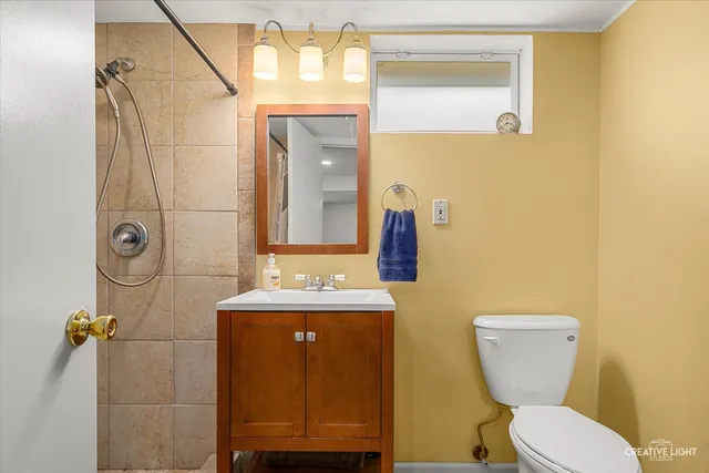 a view of a yard with an house and wooden fence