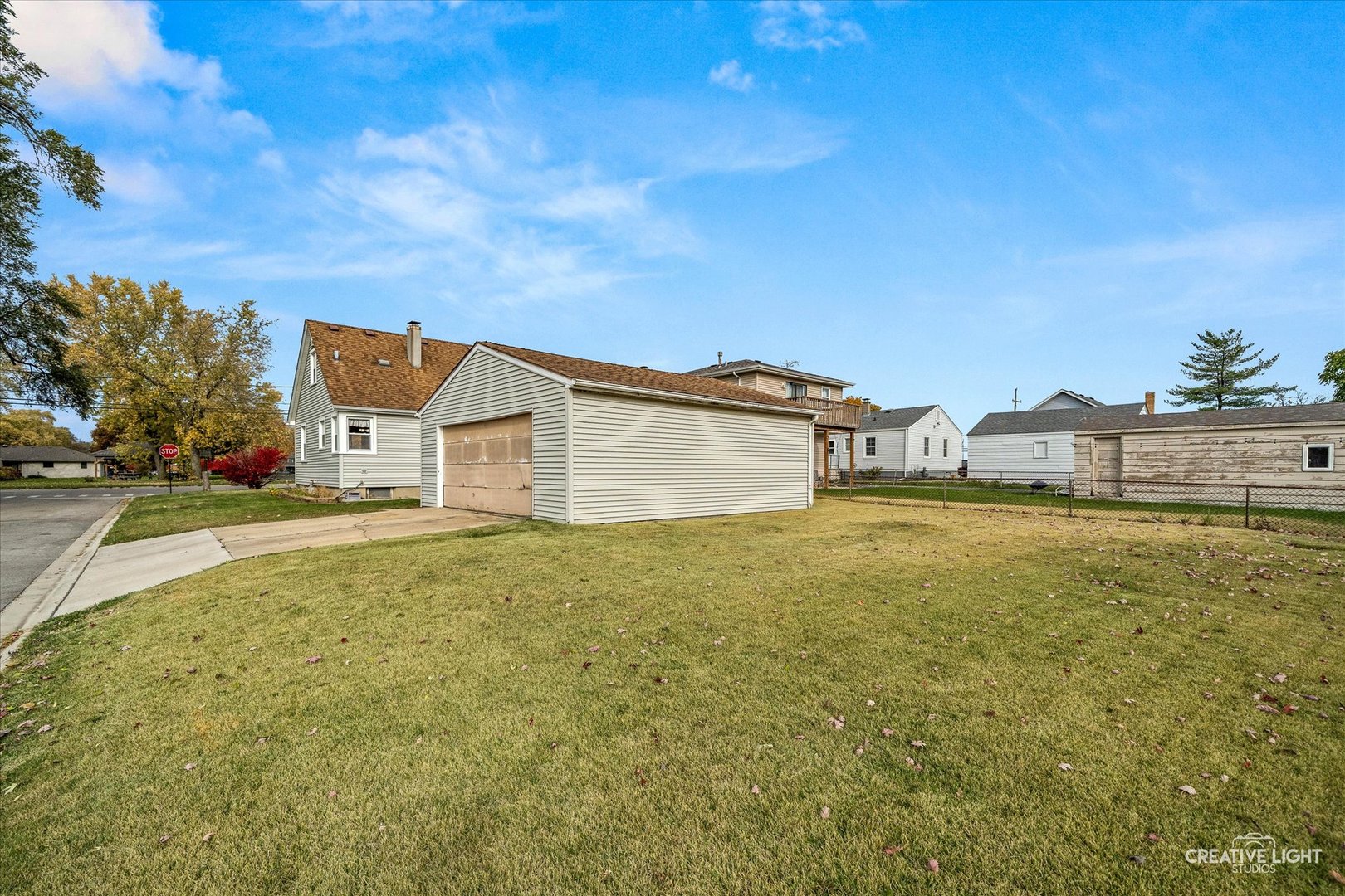 457 West Spring Street South Elgin, IL 60177 - Photo 17 of 21 a view of a yard with an house and wooden fence