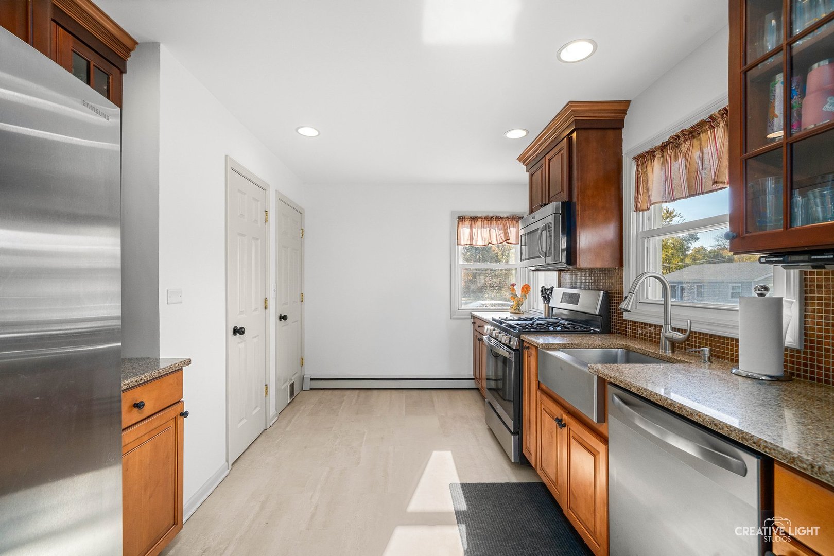 457 West Spring Street South Elgin, IL 60177 - Photo 3 of 21 a kitchen with stainless steel appliances granite countertop a stove a sink and a refrigerator