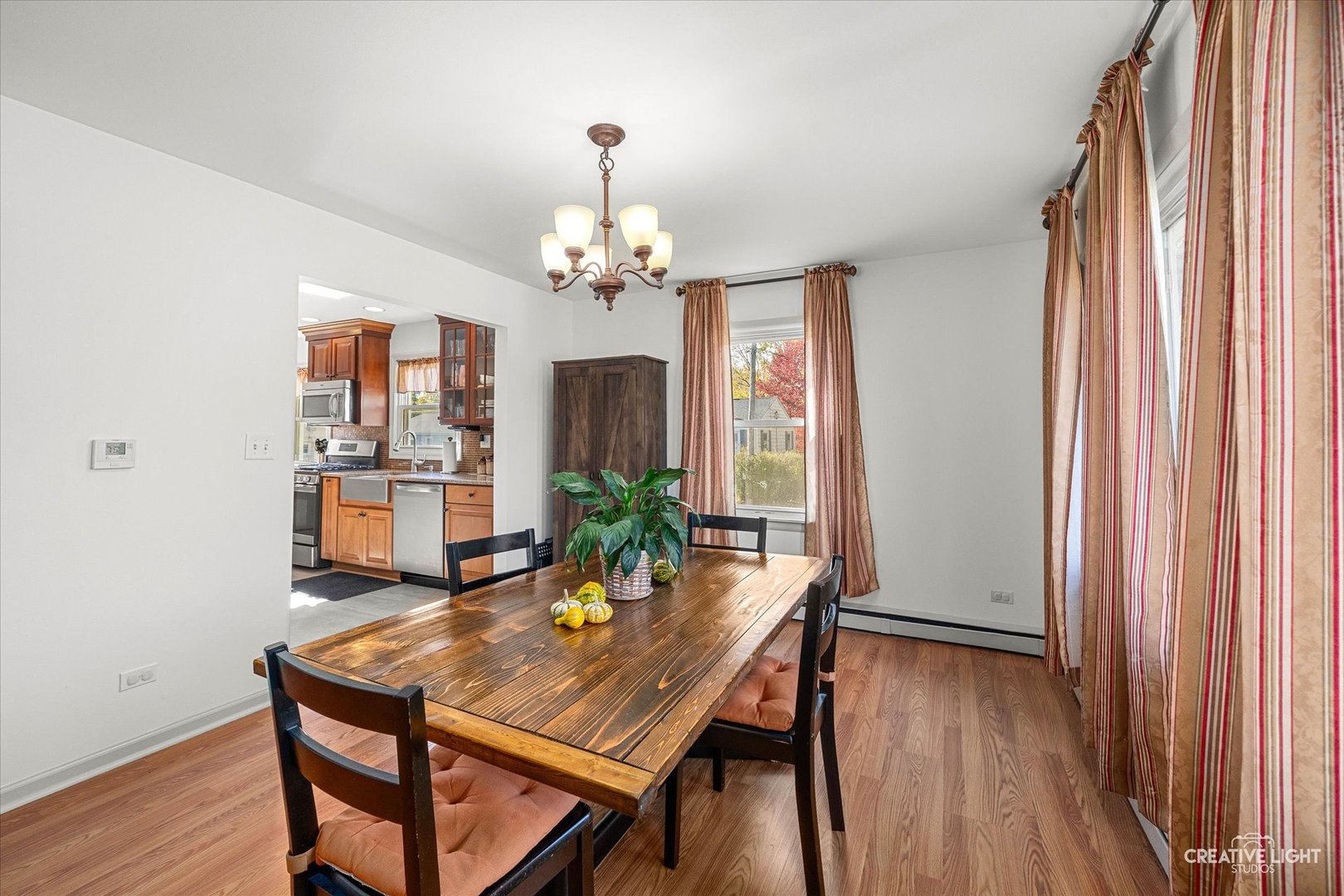 457 West Spring Street South Elgin, IL 60177 - Photo 5 of 21 a view of a dining room with furniture window and wooden floor