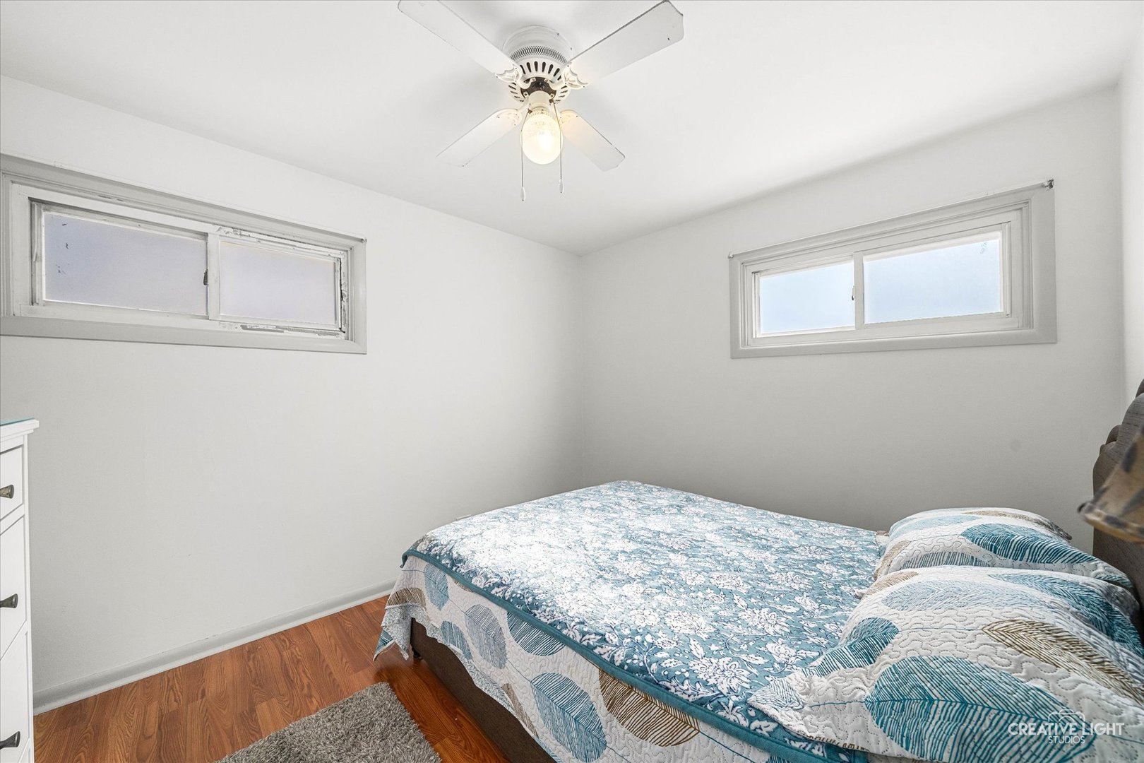 457 West Spring Street South Elgin, IL 60177 - Photo 9 of 21 a bedroom with a bed and a chandelier
