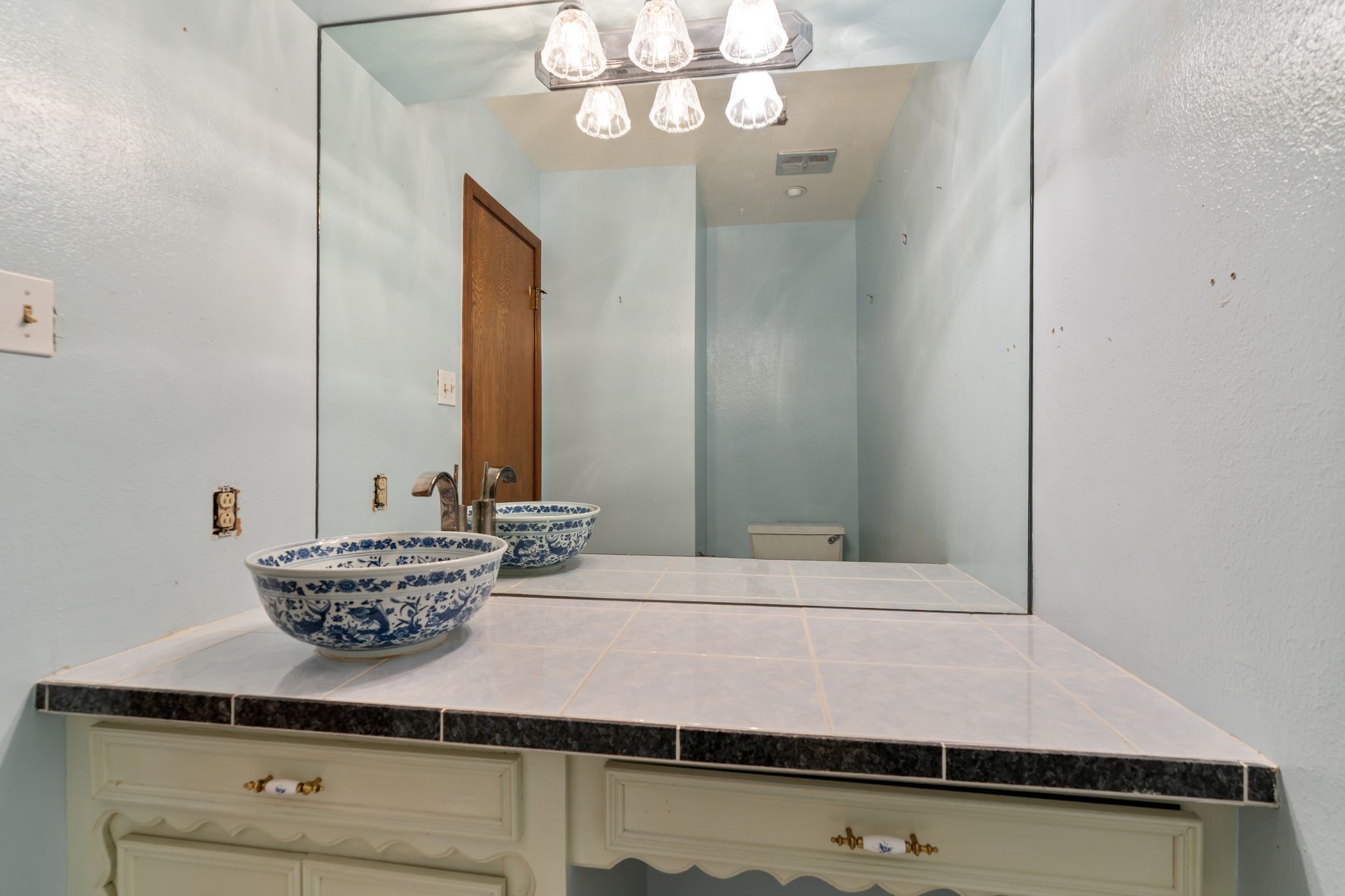 1043 Martin Street Houston, TX 77018 - Photo 11 of 45 a bathroom with a sink and a mirror