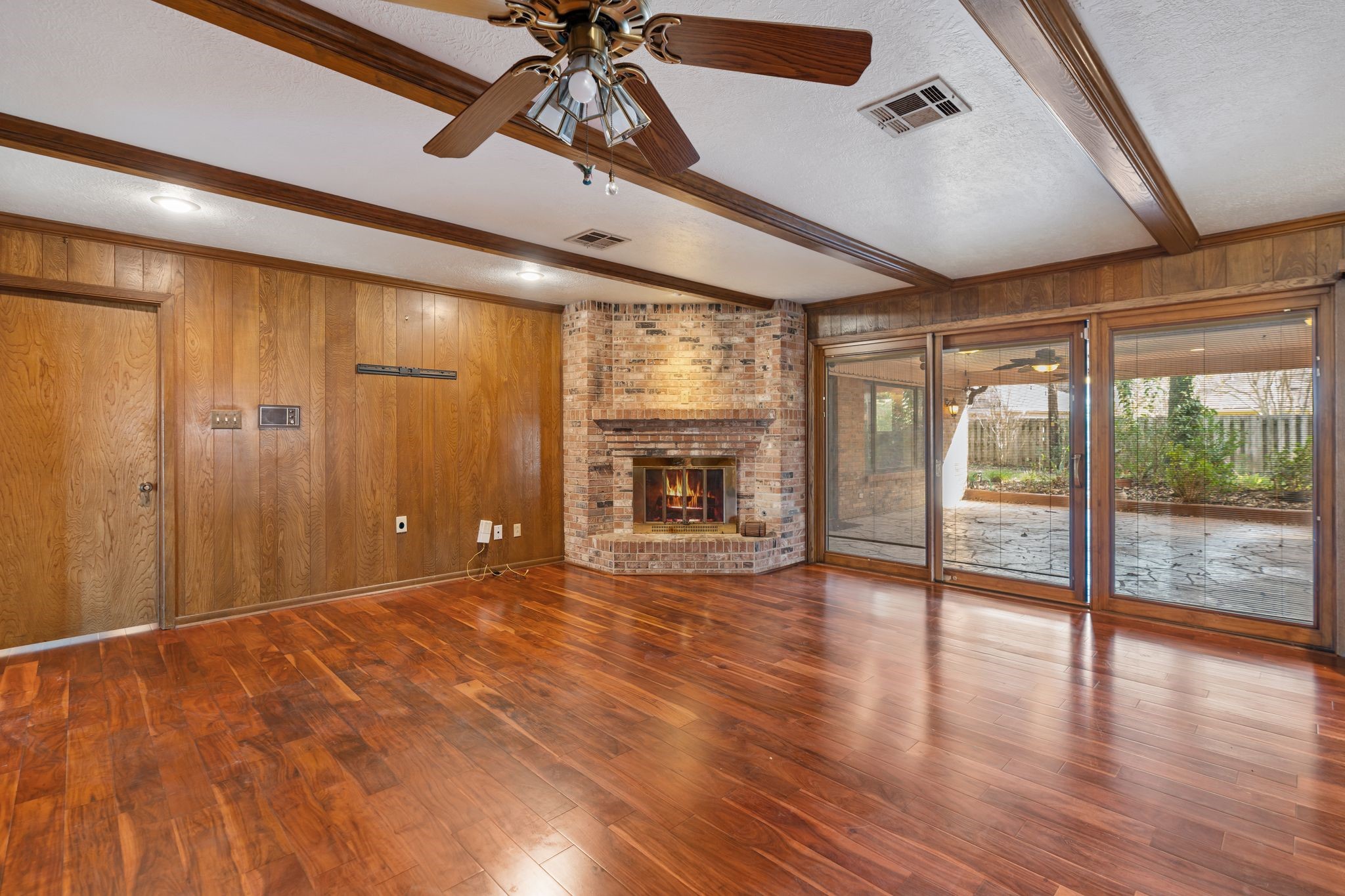 1043 Martin Street Houston, TX 77018 - Photo 18 of 45 a view of an empty room with a window and wooden floor