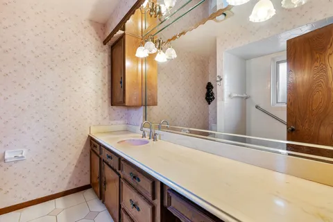 a bathroom with a sink and a mirror