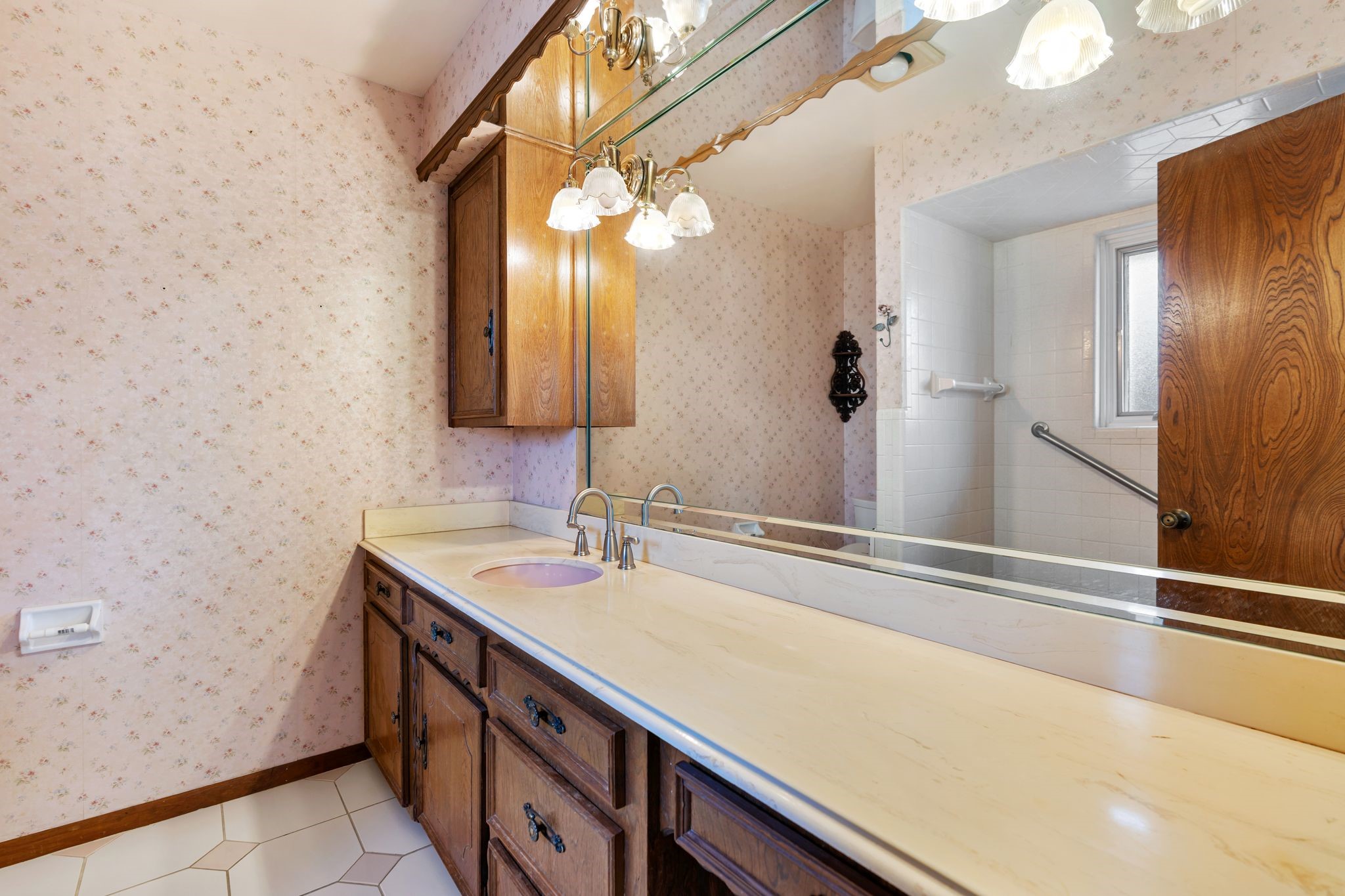 1043 Martin Street Houston, TX 77018 - Photo 23 of 45 a bathroom with a sink and a mirror