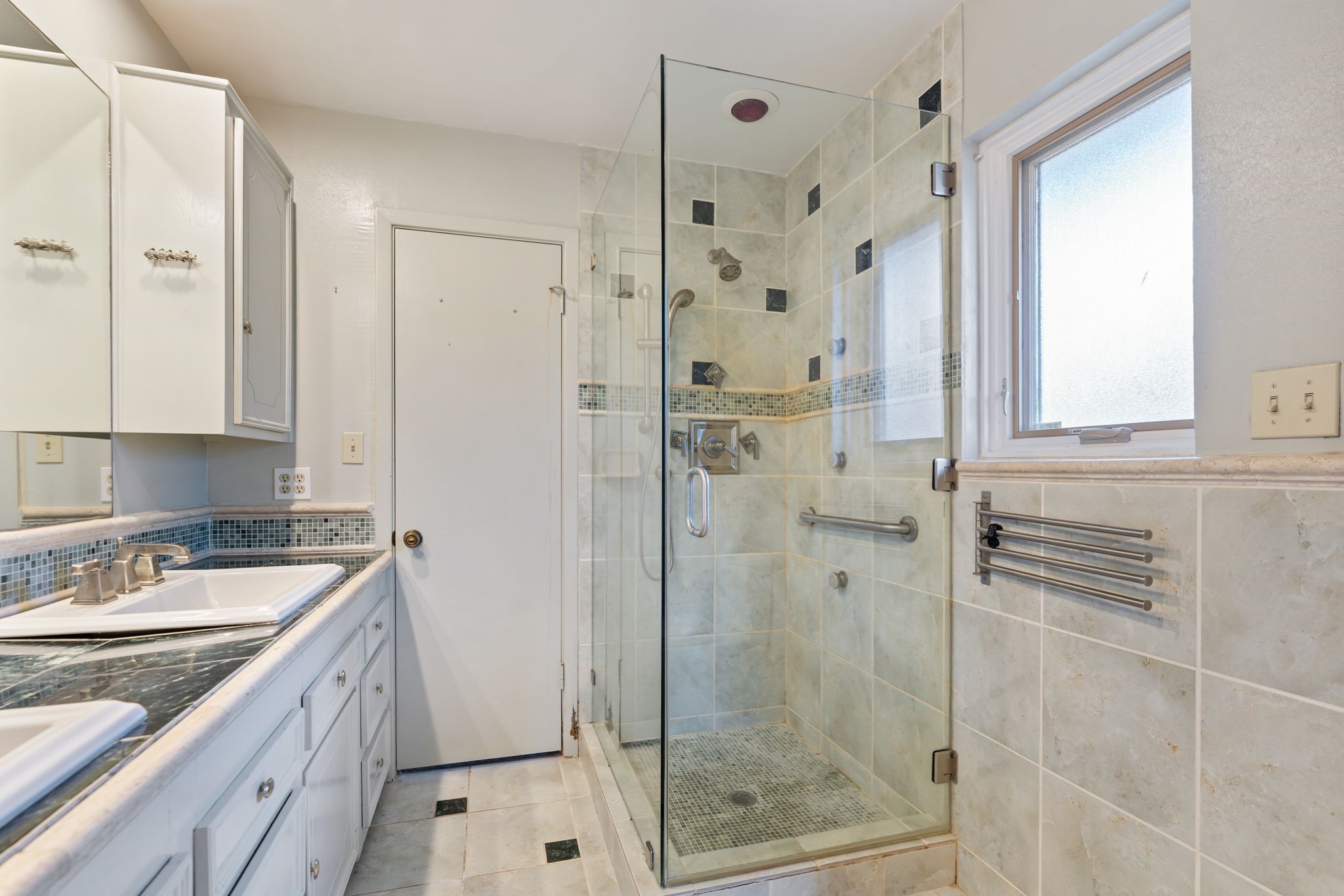 1043 Martin Street Houston, TX 77018 - Photo 26 of 45 a bathroom with a granite countertop sink a shower and a mirror