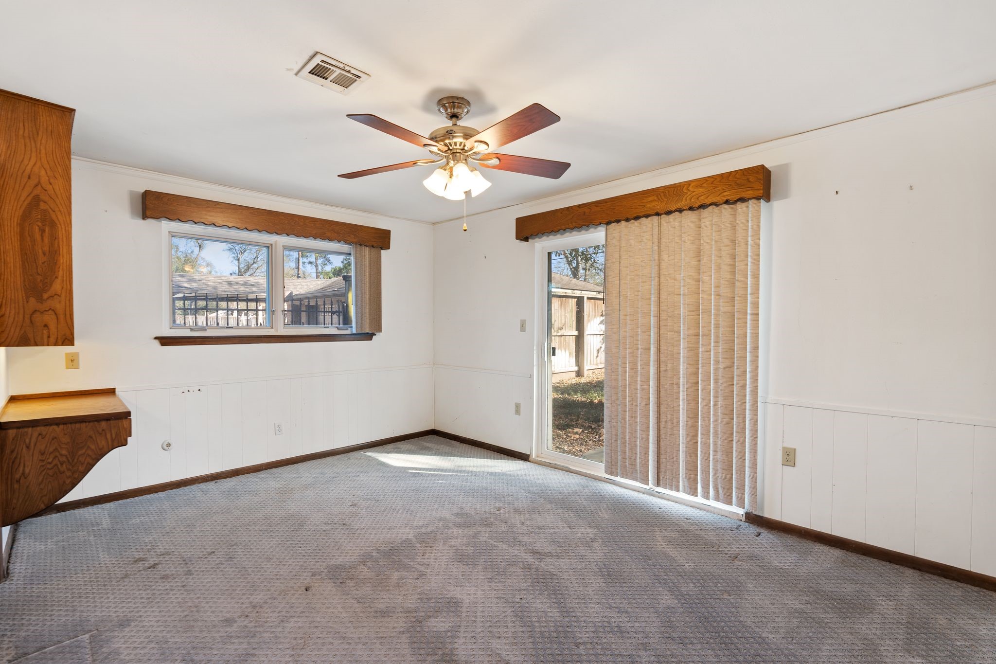 1043 Martin Street Houston, TX 77018 - Photo 29 of 45 an empty room with windows and fan