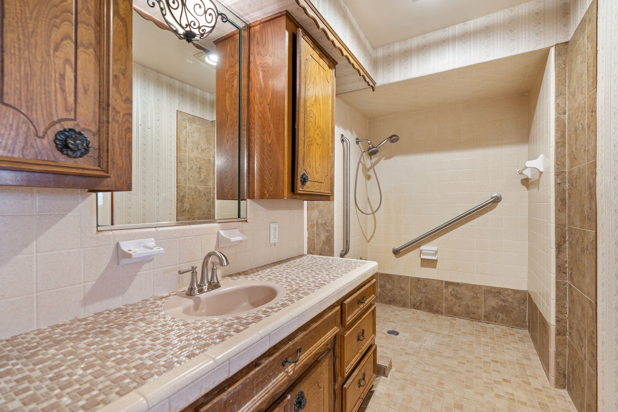 1043 Martin Street Houston, TX 77018 - Photo 36 of 45 a bathroom with a sink and a mirror