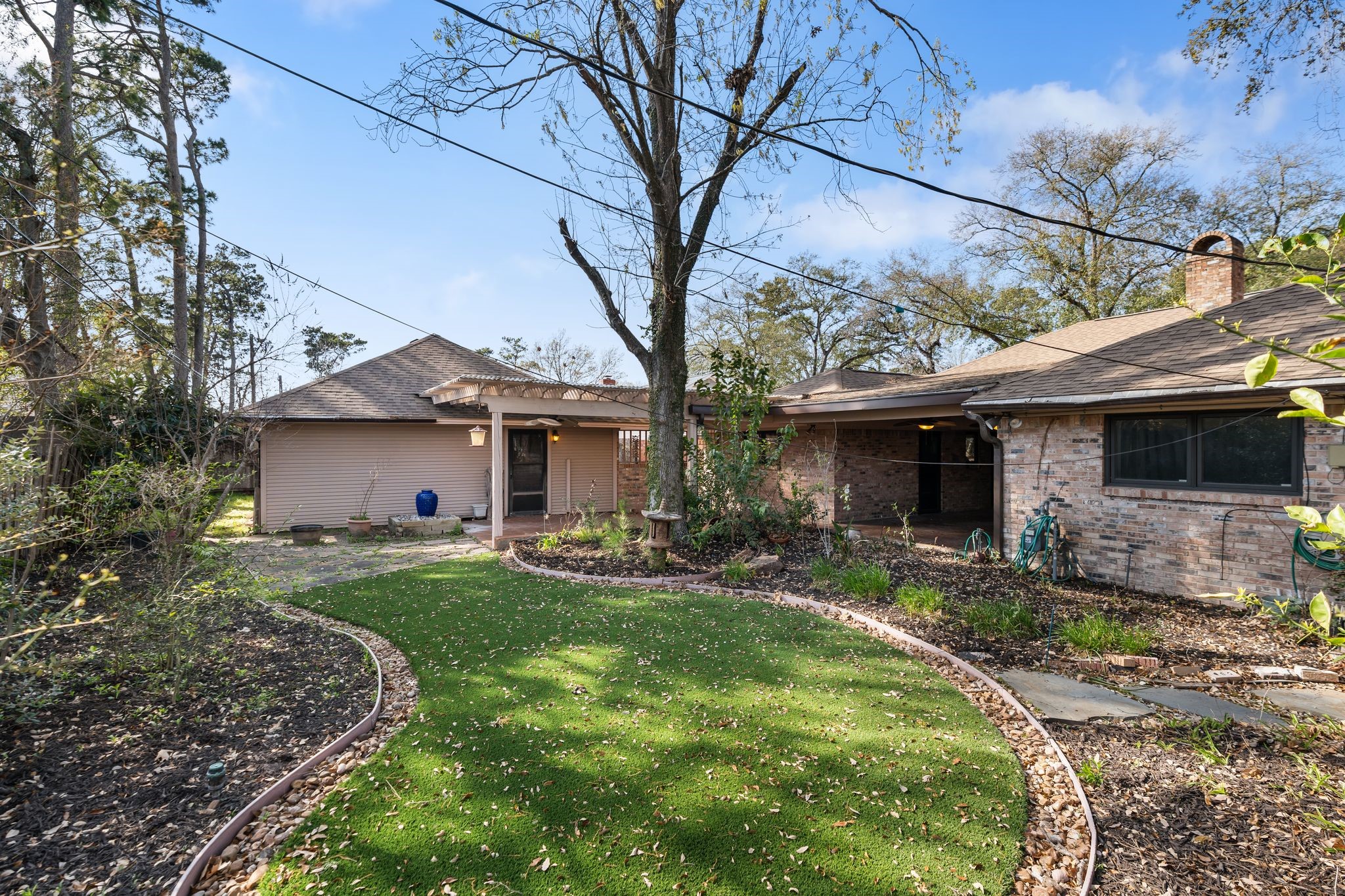 1043 Martin Street Houston, TX 77018 - Photo 40 of 45 a front view of a house with a garden and trees