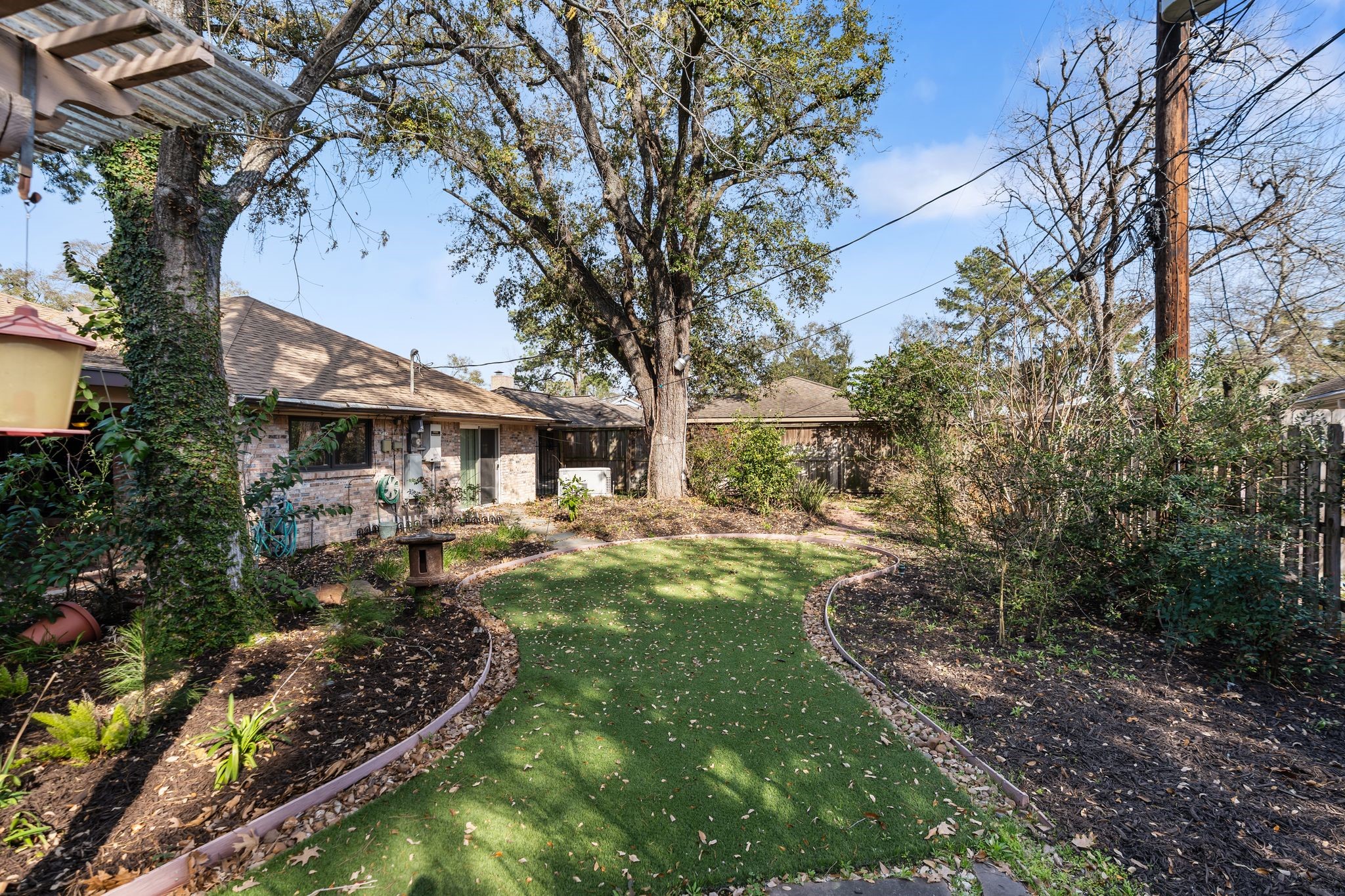 1043 Martin Street Houston, TX 77018 - Photo 7 of 45 a backyard of a house with yard and outdoor seating
