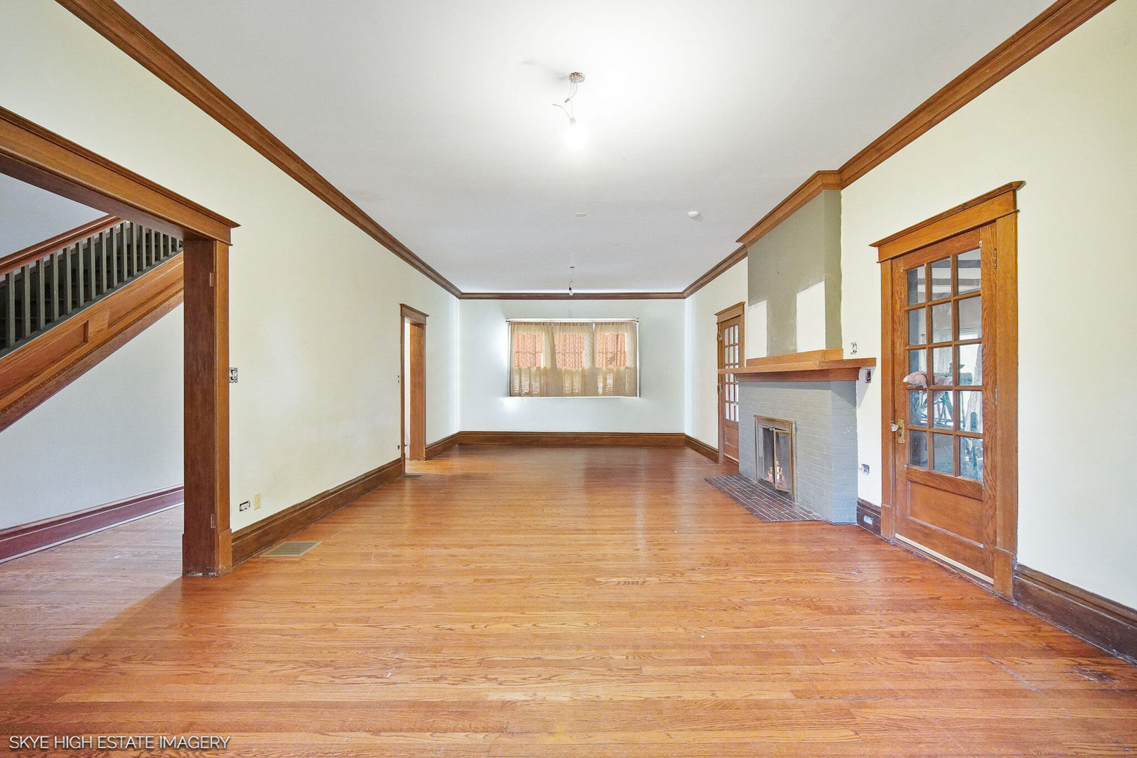 2163 Chestnut Road Homewood, IL 60430 - Photo 8 of 31 a view of empty room with wooden floor and fireplace