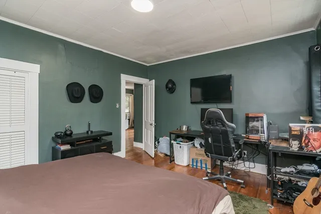 a bedroom with a workspace