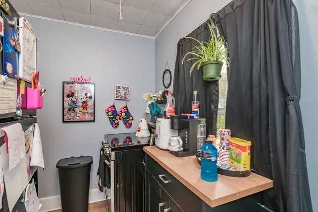 a view of a workspace with furniture and toys