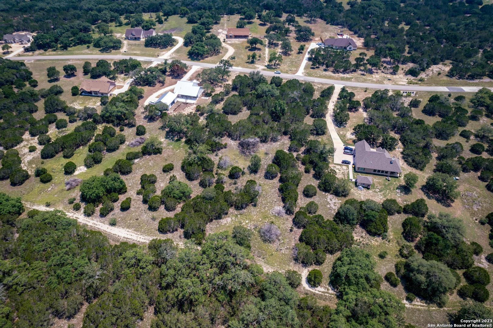 Lot 12 Rio Azul Pipe Creek, TX 78063 - Photo 15 of 30 an aerial view of residential houses with outdoor space and trees