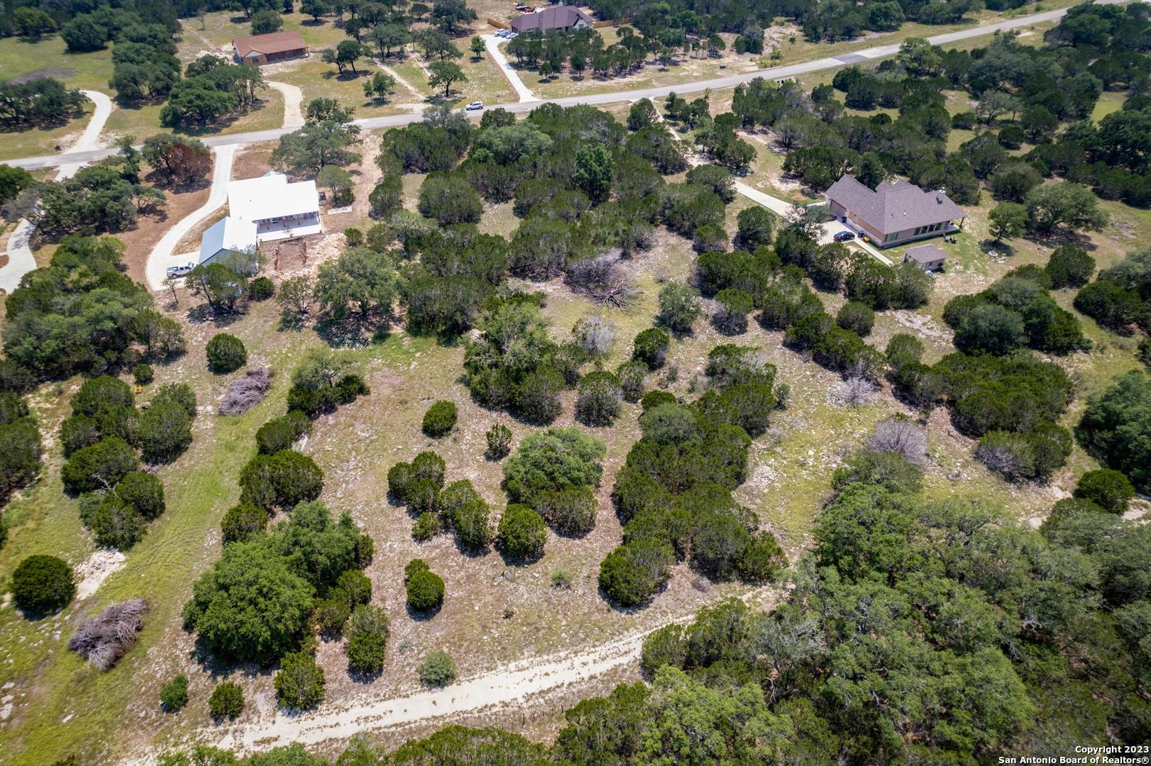 Lot 12 Rio Azul Pipe Creek, TX 78063 - Photo 18 of 30 an aerial view of residential houses with outdoor space