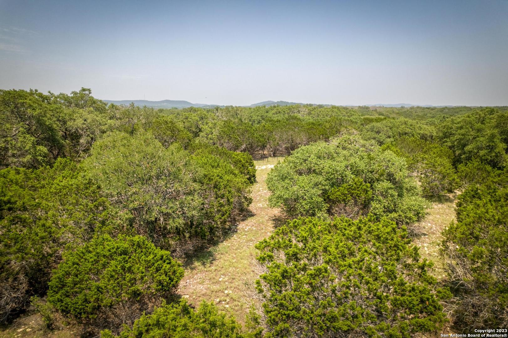 Lot 12 Rio Azul Pipe Creek, TX 78063 - Photo 21 of 30 a view of a field of grass and trees