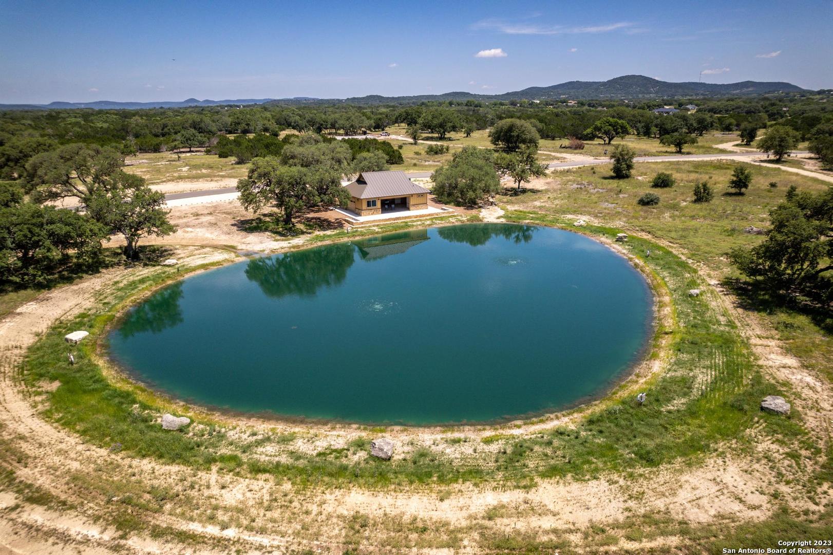 Lot 12 Rio Azul Pipe Creek, TX 78063 - Photo 6 of 30 a view of a lake with a mountain