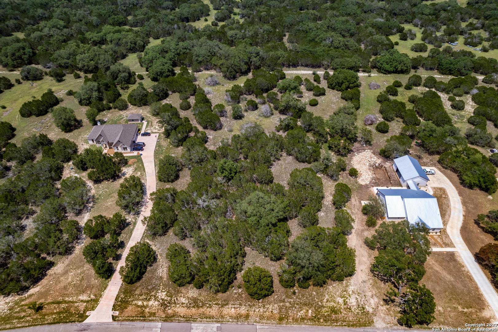 Lot 12 Rio Azul Pipe Creek, TX 78063 - Photo 9 of 30 an aerial view of residential houses with outdoor space