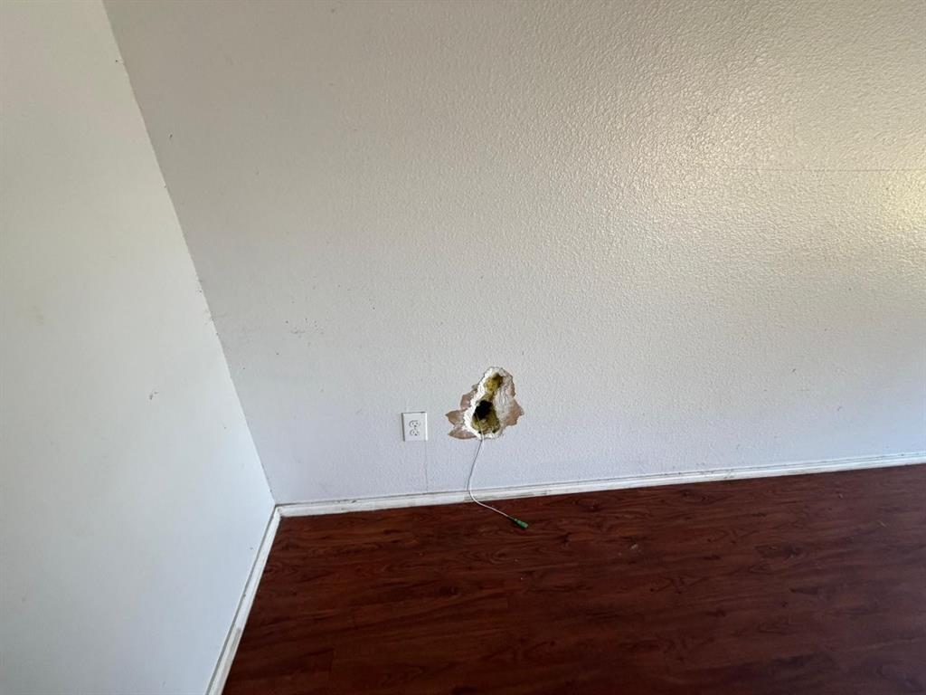 10400 Wagon Rut Court Fort Worth, TX 76108 - Photo 18 of 26 Detailed view of wood finished floors and baseboards