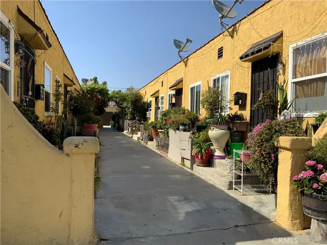 a view of path along with retail shop and buildings