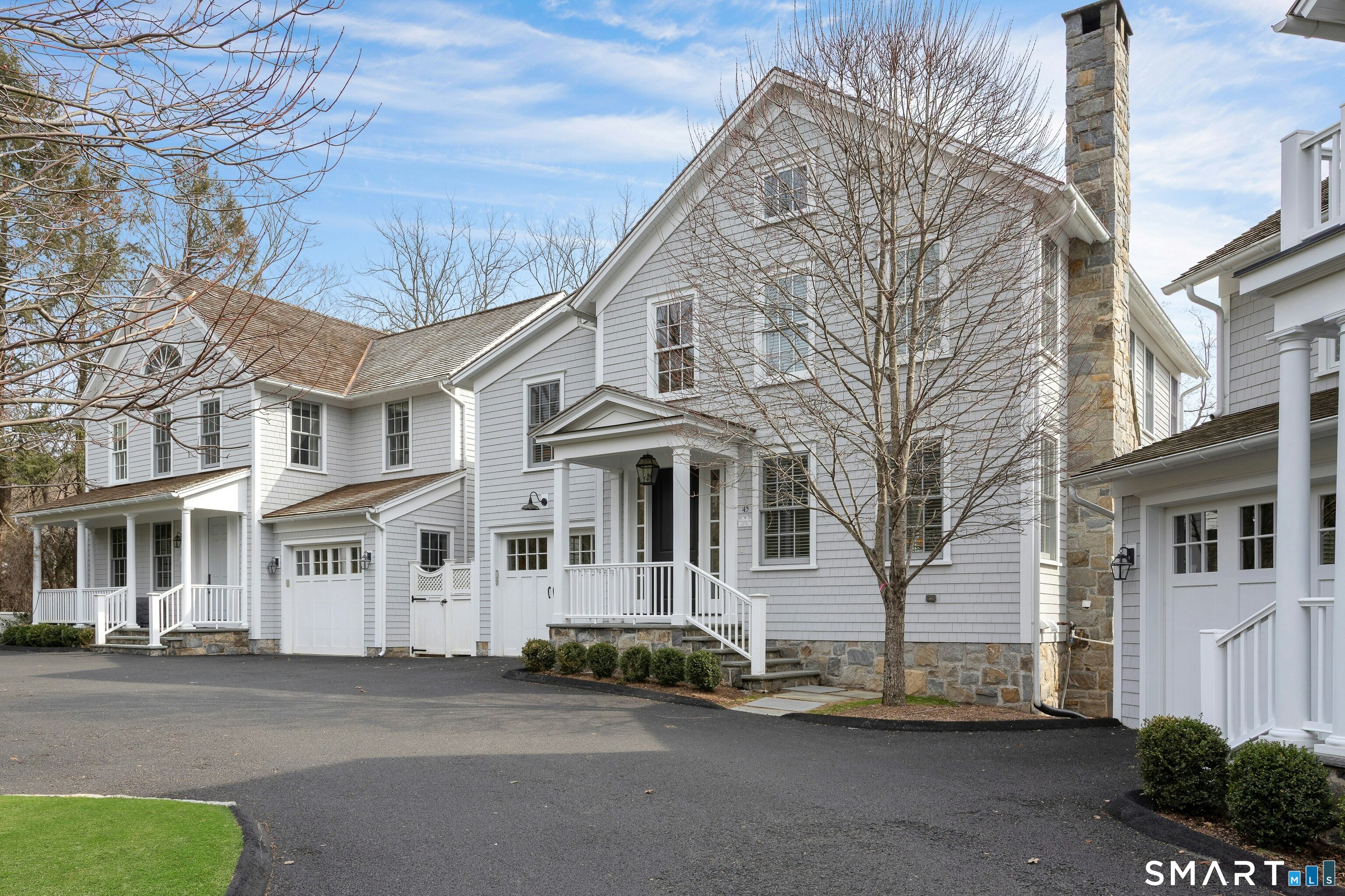 45 Jelliff Mill Road, Unit 45 New Canaan, CT 06840 - Photo 2 of 36 a front view of a building with a road