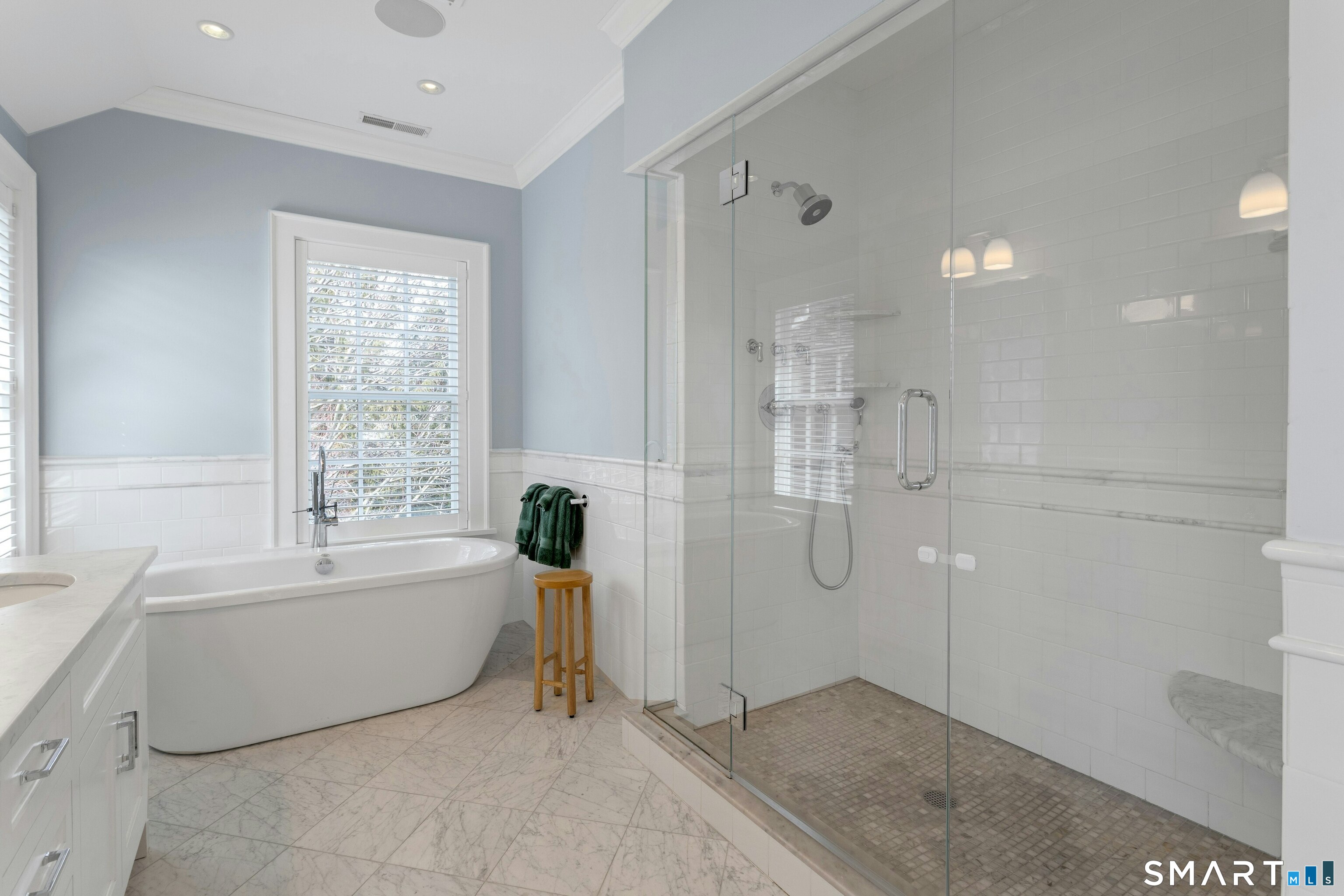 45 Jelliff Mill Road, Unit 45 New Canaan, CT 06840 - Photo 22 of 36 a spacious bathroom with a tub shower and windows