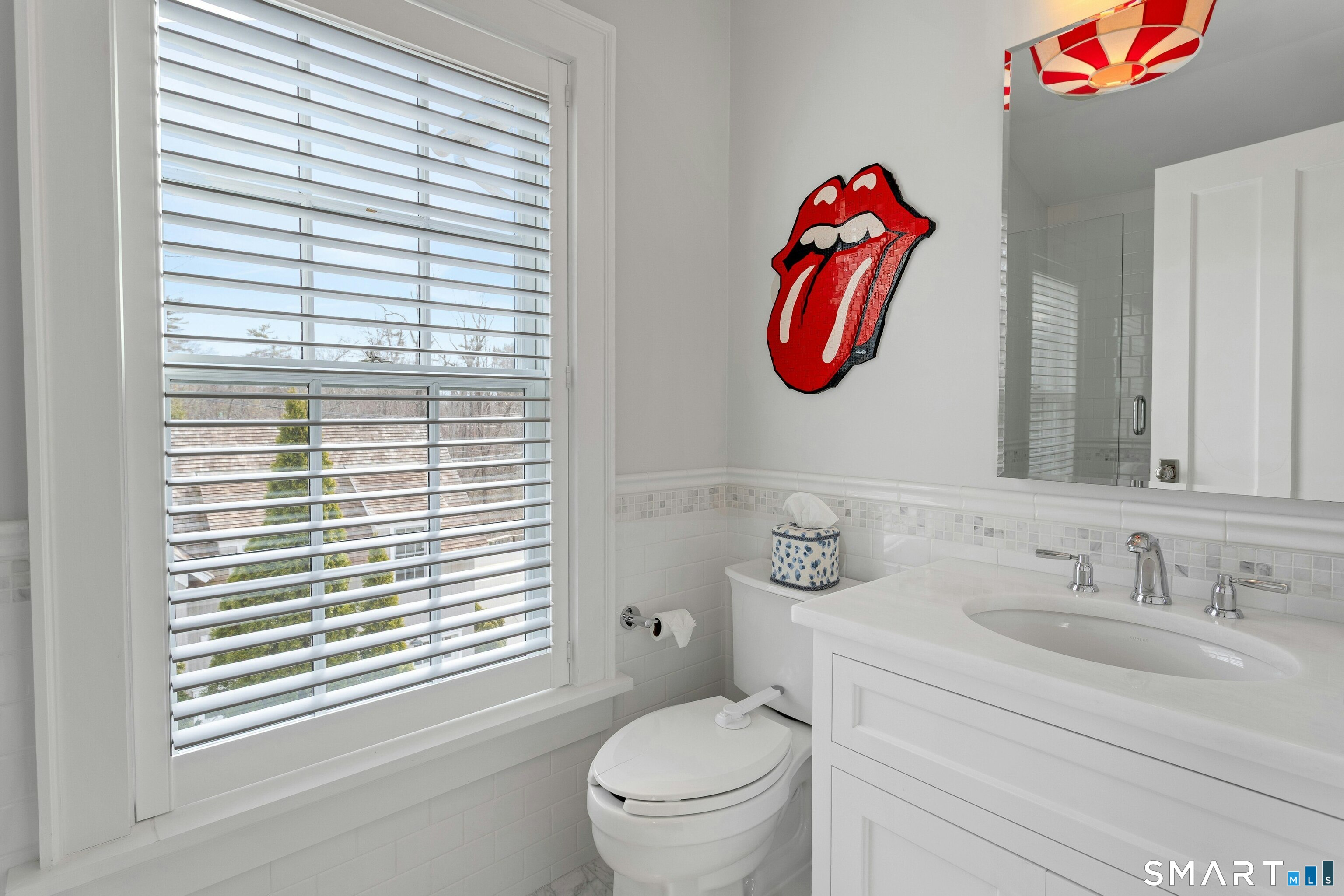 45 Jelliff Mill Road, Unit 45 New Canaan, CT 06840 - Photo 25 of 36 a bathroom with a sink and a toilet